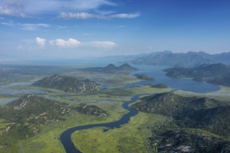 Aerial view of Rijeka Crnojevica, beautiful river between mountains flowing into Skadar Lake,