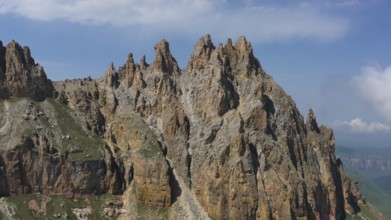 Aerial view on Naujiza or Mother-in-law teeth mountain with fantastic cliffs in Kabardino-Balkaria,