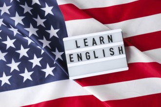 American flag. Lightbox with text LEARN ENGLISH Flag of the united states of America. July 4th
