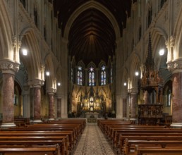 Cobh, Ireland, 15 August, 2022: view of the central nave and altar with the elegant wooden pulpit