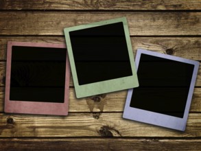 Photo of photo frames at abstract wooden background