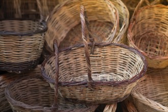 Empty wicker baskets are seein a market place
