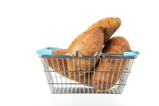 Shopping basket with sweet potatoes isolated over white background