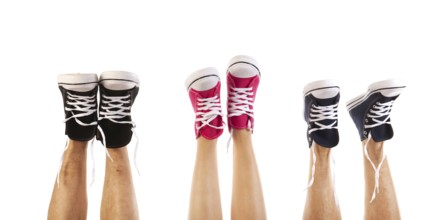 Feet in basketball shoes isolated over white background