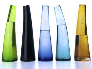 Multicoloured glass vases with liquid (clipping path)