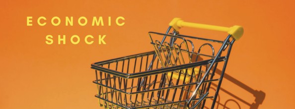 ECONOMIC SHOCK text Empty shopping trolley cart on colorful orange background. Online shopping, buy
