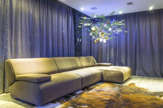 Beautiful living room with modern Christmas decoration, bamboo decorated with ornaments and
