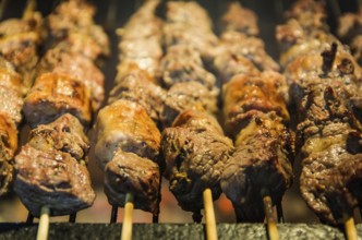 Juicy meat barbecue skewer (Churrasquinho, espetinho) in close up