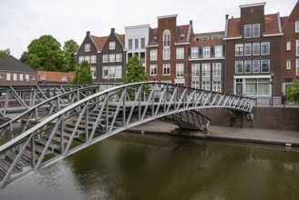 Hulst, Zeeland, The Netherlands, May 21, 2023, Pedestrian bridge and historical buildings at the