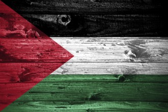 Palestine flag on wooden planks background wood flag
