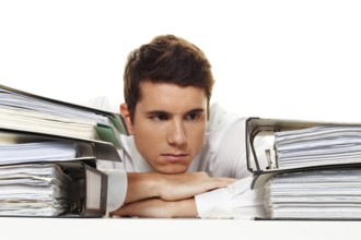 A manager under stress with piles of files. Bureaucracy in Administration Austria