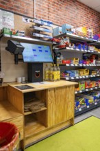 Digital checkout and shelves full of products in a modern supermarket, Tante M, self-service shop,