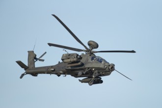Agusta Westland AH-64 Apache helicopter aircraft in British Army air corps colours flying, England,