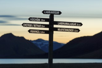 Signpost for hikers stands out against the evening sky, Laugavegur, Iceland's most famous hiking