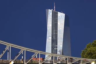 After a storm, the glass façade of the European Central Bank (ECB) shines in the sunlight,