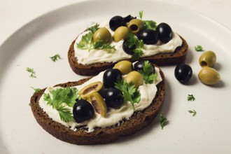 Breakfast, sandwiches, with cream cheese, olives, top view