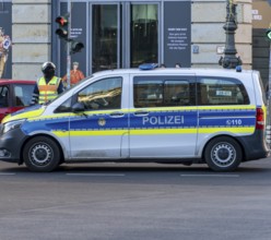 Police officer of the Berlin motorbike squad regulates traffic, Unter den Linden, Berlin, Germany,