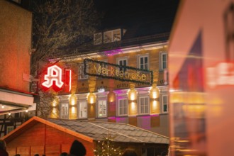 An illuminated pharmacy and the market street at night, Lichternacht Fest, Nagold, Black Forest,
