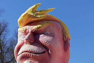 US President Donald Trump, head with yellow quiff, papier-mâché figure, Jacques Tilly theme float,