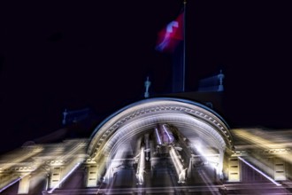Beautiful Illuminated Swiss National Bank and Swiss Flag at Night in City of Bern, Bern Canton,