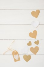 Small paper hearts scattered table
