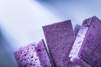 New dishwashing sponges on white background
