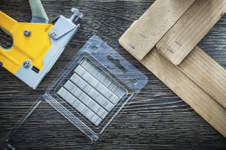 Building stapler gun staples wooden planks