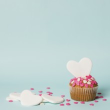 Tasty cake with decorative hearts