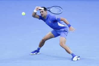 MELBOURNE, AUSTRALIA, JANUARY 11: Novak Djokovic of Serbia plays Stefanos Tsitsipas of Greece