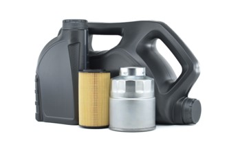 Vehicle engine oil filters and motor oil cans isolated on a white background. Containers, plastic