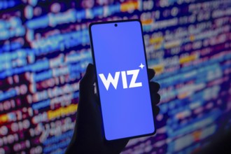 In this photo illustration, the Wiz logo is displayed on a smartphone screen