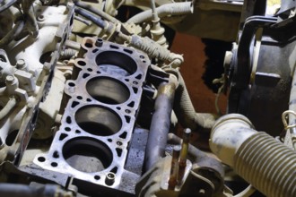 The cylinder block of the four-cylinder engine. Disassembled motor vehicle for repair. Parts in