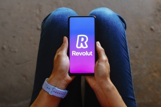 In this photo illustration, the Revolut logo is displayed on a smartphone mobile screen