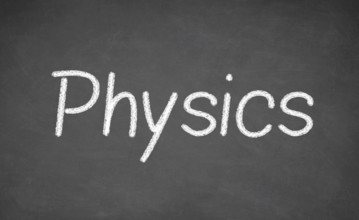 Physics lesson on blackboard or chalkboard. written in white chalk