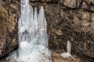Looking down on frozen waterfall in deep crater located in Gyeonggi province of South Korea