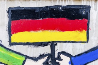 The German flag painted on a house wall Austria