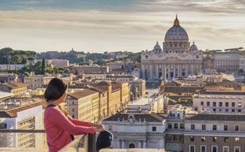 Rome Vatican Italy high angle view sunset city skyline with woman tourist