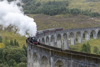 The Jacobite Steam Train, steam railway on the Glenfinnan railway viaduct, known from Harry Potter,