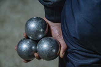 Three balls in hand, Boule Carli, Petanque player, Marseille, France, Europe
