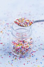 Colorful sugar sprinkles for baking in icy tone - baking concept