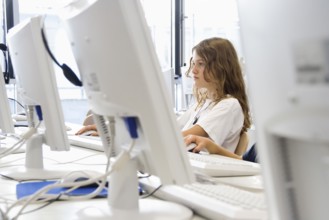 Girl with computer at school