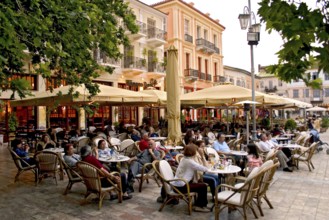 Guests in street cafe, Plateia Sindagmatos square, Nafplion, Nafplio, Peloponnese, Greece, Europe