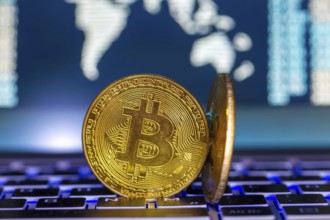 Symbolic bitcoins on a laptop