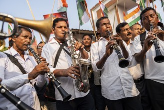 Band members play music as they take part in a rally, in soliderity with the Indian armed forces in