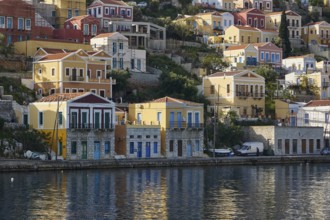 Colourful houses on the shore with water view, Symi Town, Symi, Dodecanese, Greek Islands, Greece,