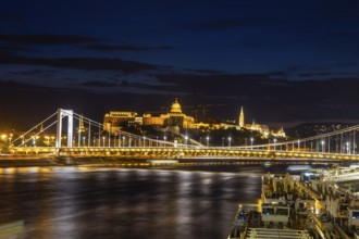 Budapest at night with the Danube, the illuminated Elisabeth Bridge and the illuminated Castle