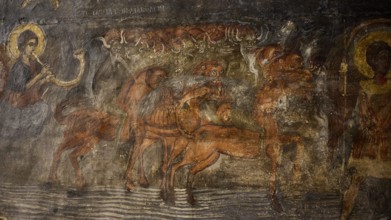 Fabulous creatures with horns and hooves appear in the fresco in an active and dynamic scene,