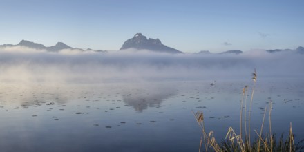 Sunrise at Lake Hopfensee near Füssen, with the Tegelberg massif and the Säuling behind it,
