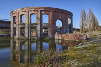 Park, pond, artificial ruin, trees, car and pedestrian bridge, symmetrical reflections, water