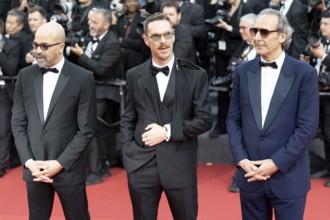 Cannes, France - 18.5.2024: Jeffrey Wright, Benedict Cumberbatch and Alexandre Desplat on the red